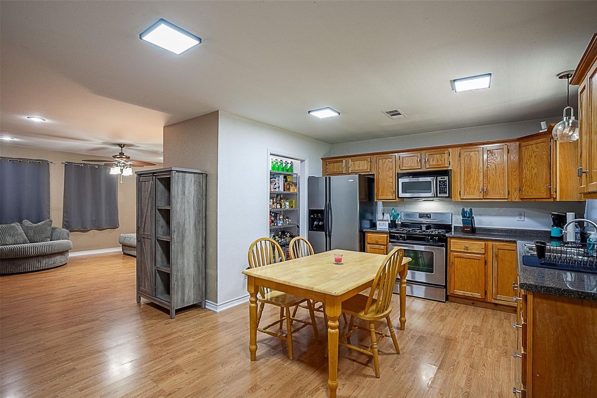 Dining room, Interior, Kitchen, Recessed Lighting, Stainless Steel Appliances, Wood Texture Flooring