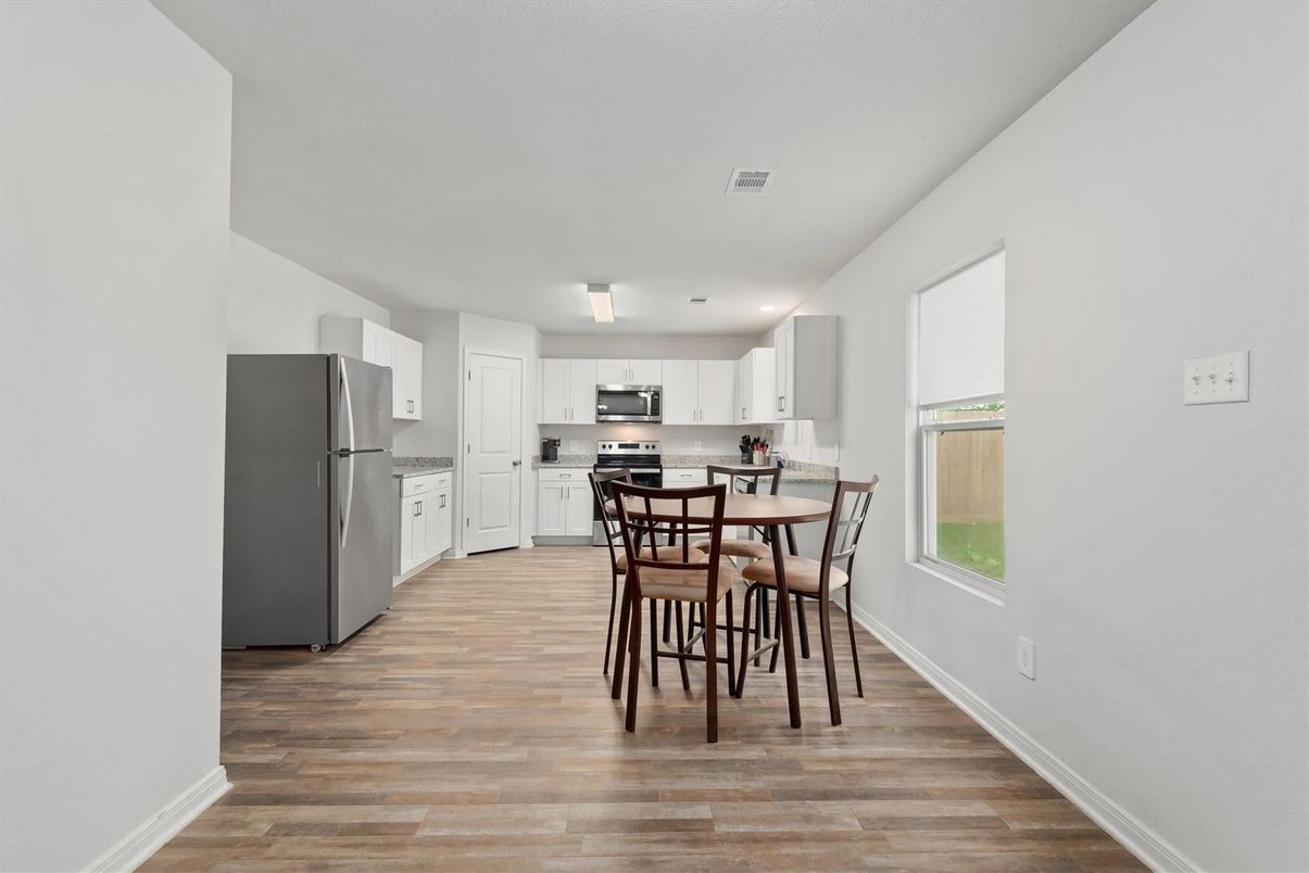 Dining room, Interior, Kitchen, Recessed Lighting, Stainless Steel Appliances, Wood Texture Flooring