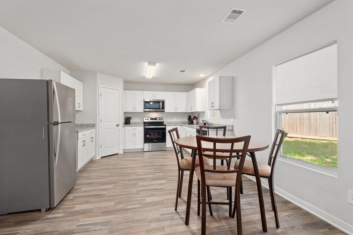 Dining room, Interior, Kitchen, Recessed Lighting, Stainless Steel Appliances, Wood Texture Flooring