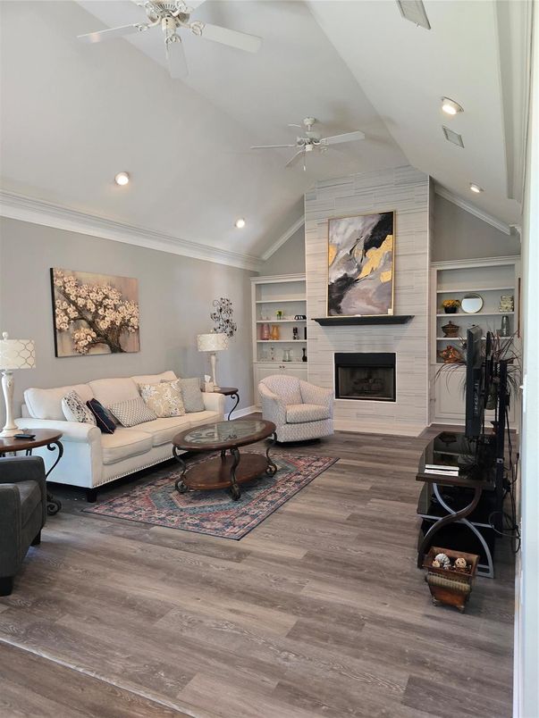 Fireplace, Interior, Living room, Recessed Lighting, Stone Walls, Wood Texture Flooring