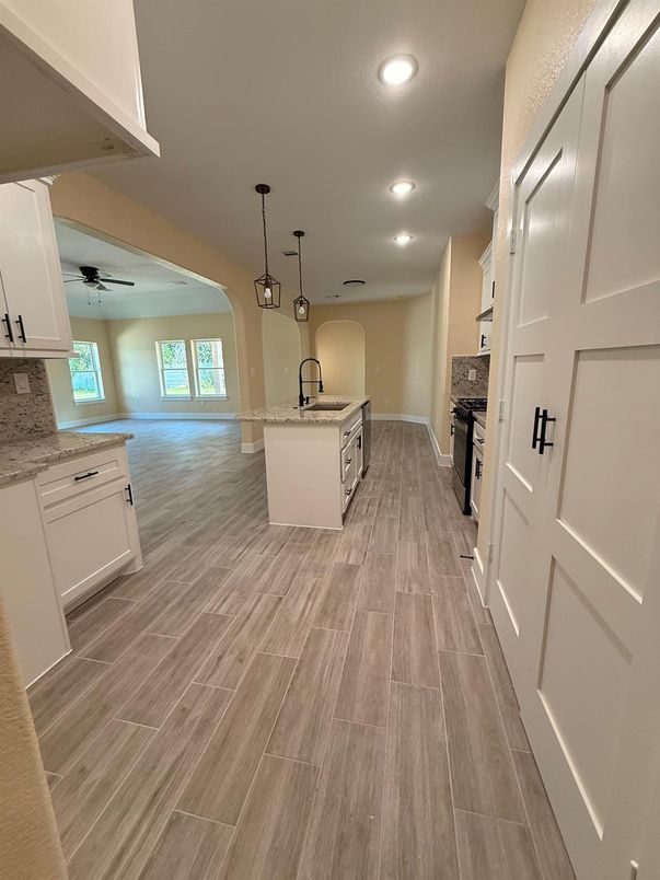 Fireplace, Interior, Kitchen, Pendant Lights, Recessed Lighting, Wood Texture Flooring