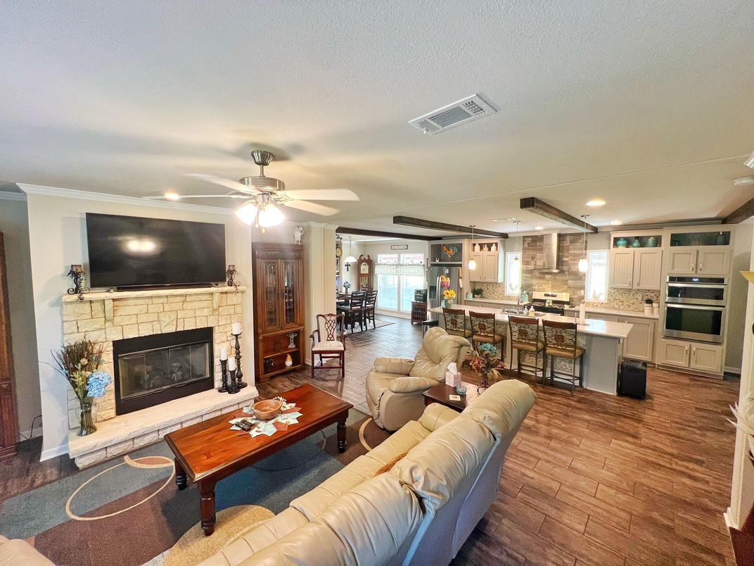 Dining room, Fireplace, Interior, Kitchen, Living room, Pendant Lights, Recessed Lighting, Stainless Steel Appliances, Stone Walls, Wood Texture Flooring