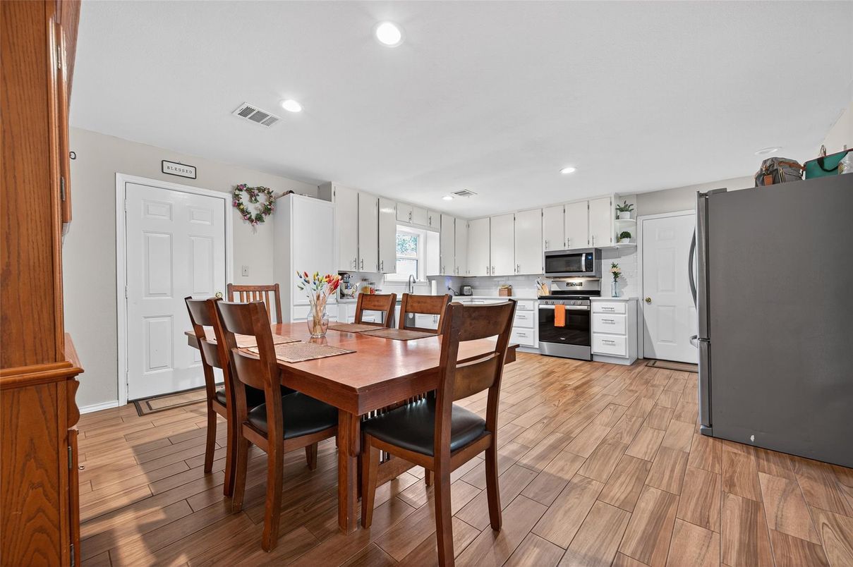 Dining room, Interior, Kitchen, Recessed Lighting, Stainless Steel Appliances, Wood Texture Flooring