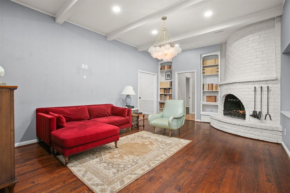 Chandelier, Fireplace, Interior, Living room, Pendant Lights, Recessed Lighting, Stone Walls, Wood Texture Flooring