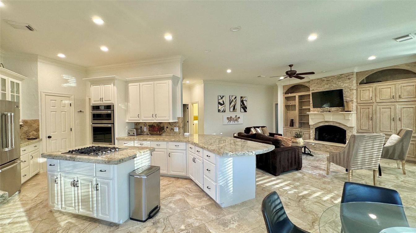 Fireplace, Interior, Kitchen, Living room, Recessed Lighting, Stainless Steel Appliances, Stone Walls