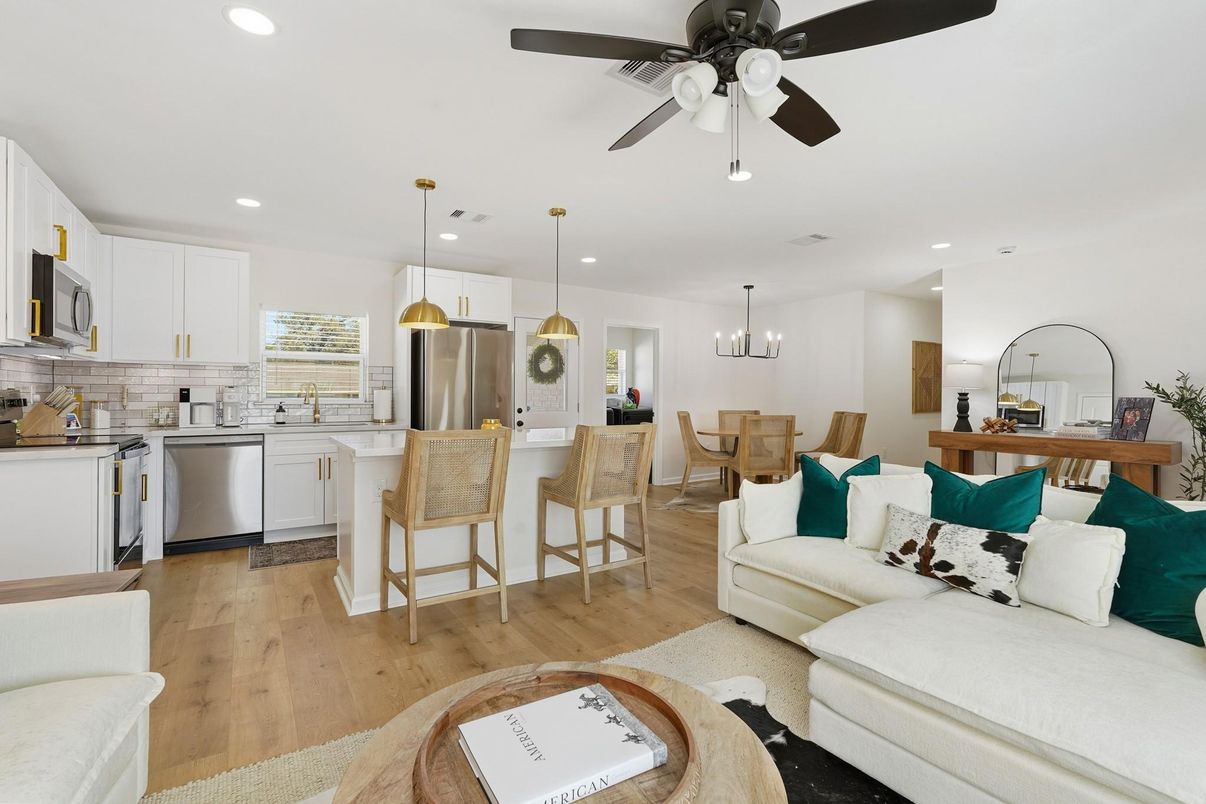 Chandelier, Dining room, Interior, Kitchen, Living room, Pendant Lights, Recessed Lighting, Stainless Steel Appliances, Wood Texture Flooring