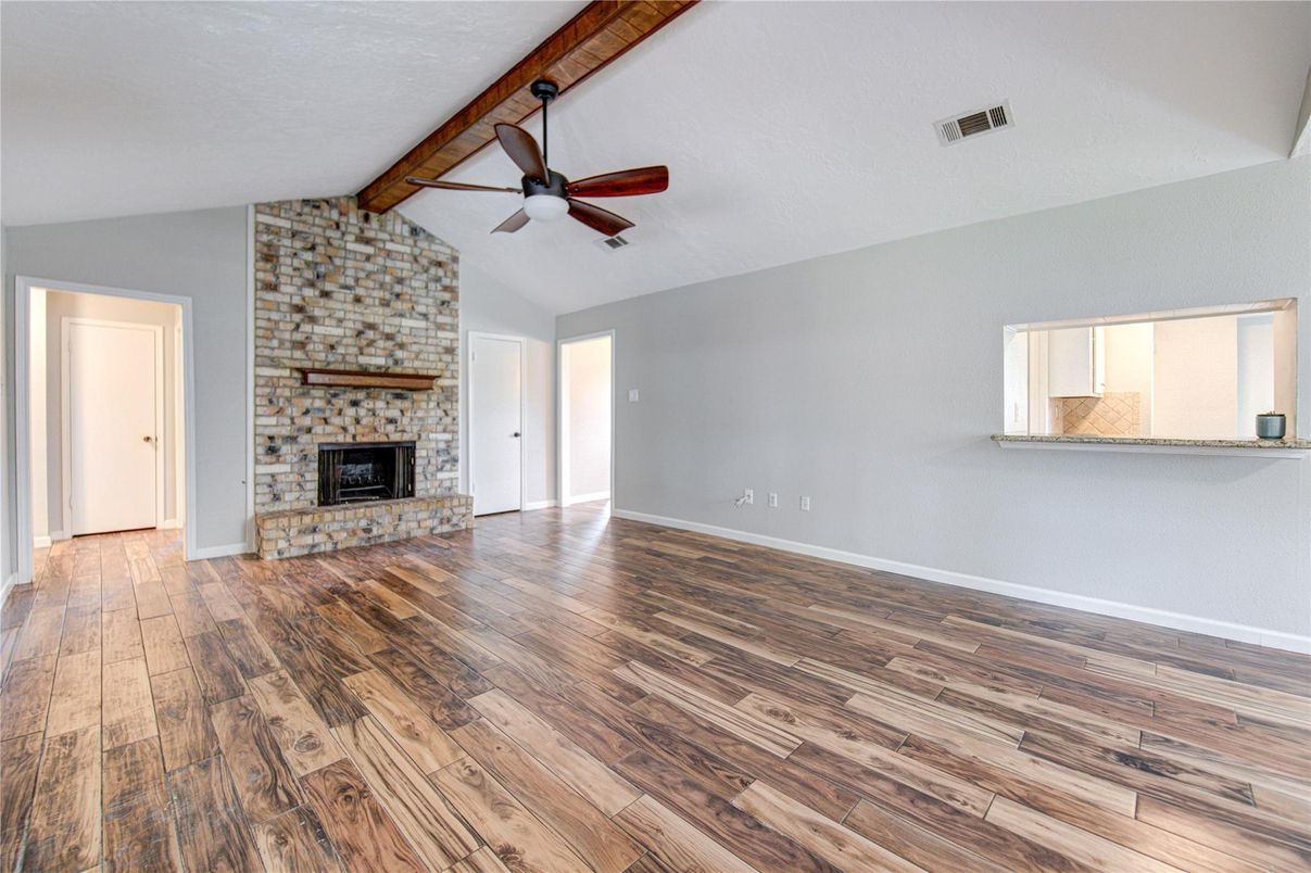 Empty room, Fireplace, Interior, Stone Walls, Wooden Beams, Wood Texture Flooring