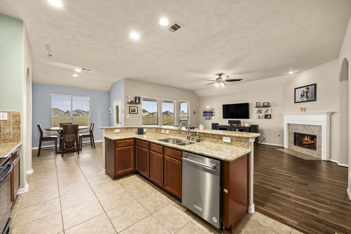 Dining room, Fireplace, Interior, Kitchen, Recessed Lighting, Wood Texture Flooring