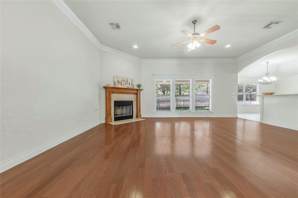 Chandelier, Empty room, Fireplace, Interior, Recessed Lighting, Wood Texture Flooring