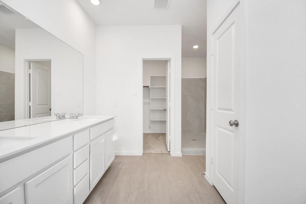 Bathroom, Dual Sink Vanities, Interior, Recessed Lighting, Walk-in Closets, Wood Texture Flooring