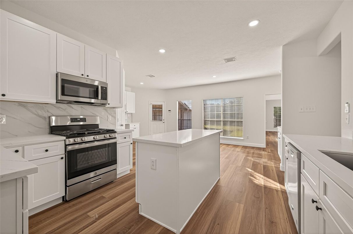 Interior, Kitchen, Marble Walls, Recessed Lighting, Stainless Steel Appliances, Wood Texture Flooring