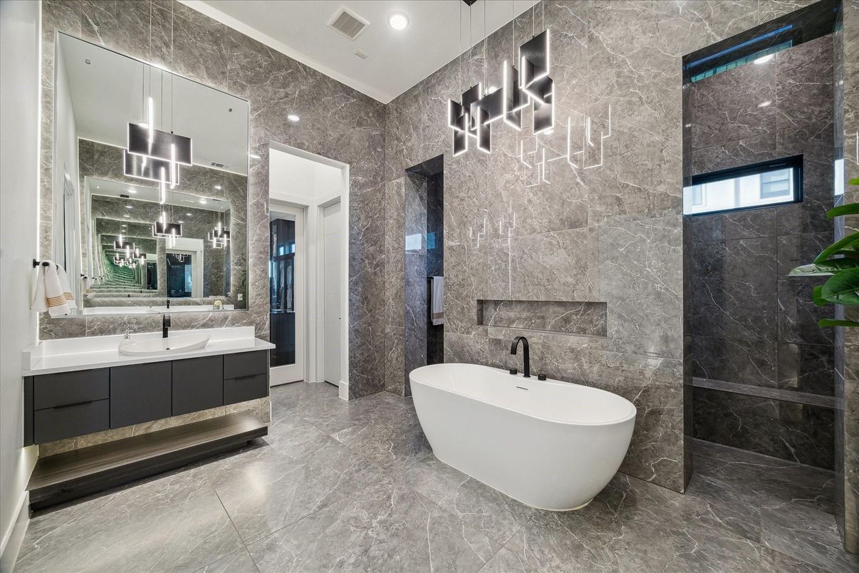 Bathroom, Dual Sink Vanities, Free Standing Baths, Interior, Marble, Marble Walls, Pendant Lights, Recessed Lighting