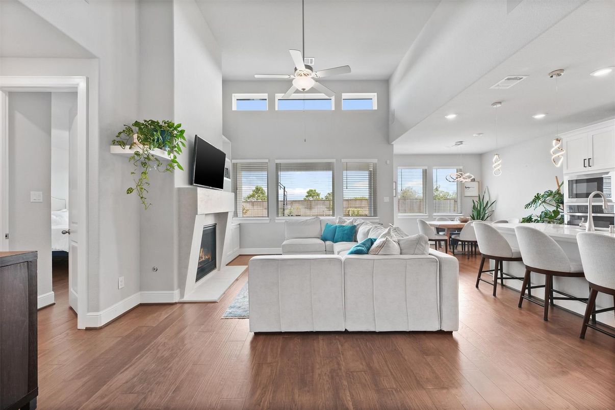 Dining room, Fireplace, Interior, Living room, Pendant Lights, Recessed Lighting, Wood Texture Flooring