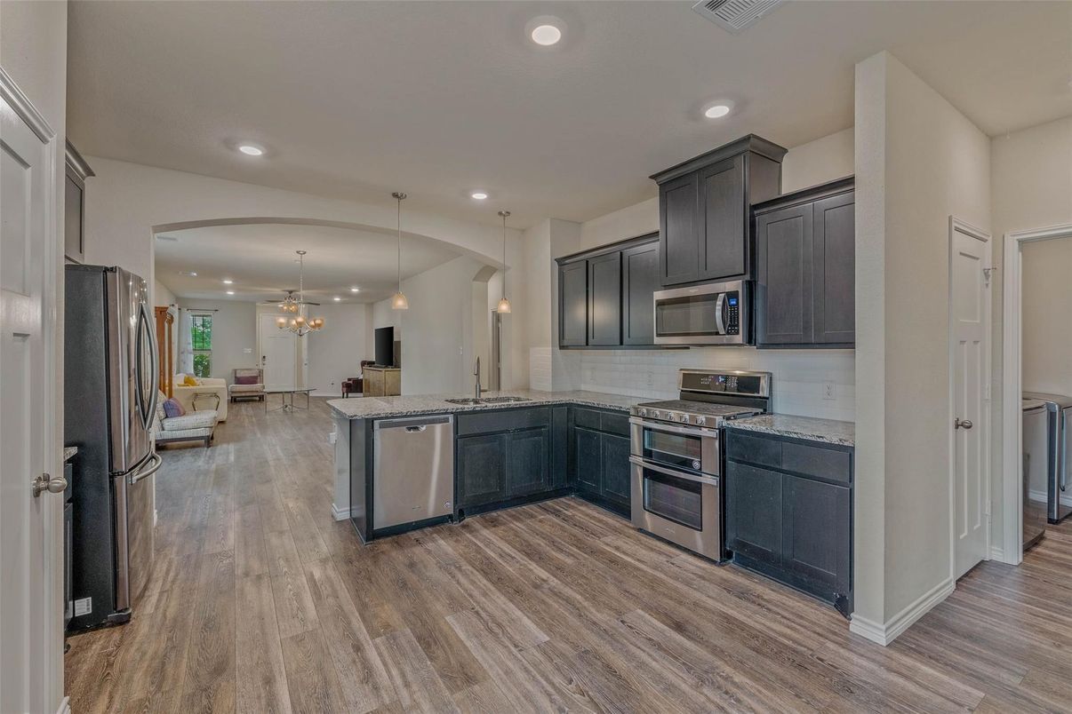 Chandelier, Interior, Kitchen, Pendant Lights, Recessed Lighting, Stainless Steel Appliances, Wood Texture Flooring