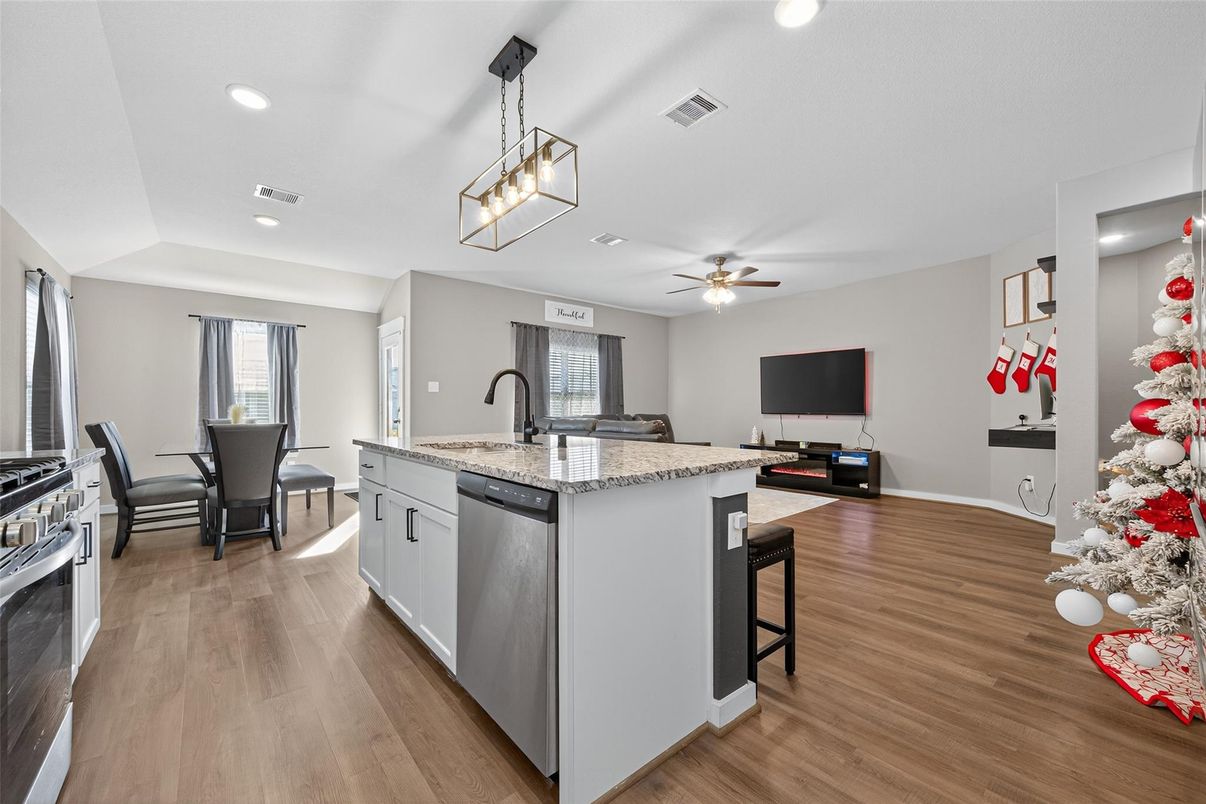 Dining room, Interior, Kitchen, Pendant Lights, Recessed Lighting, Stainless Steel Appliances, Wood Texture Flooring