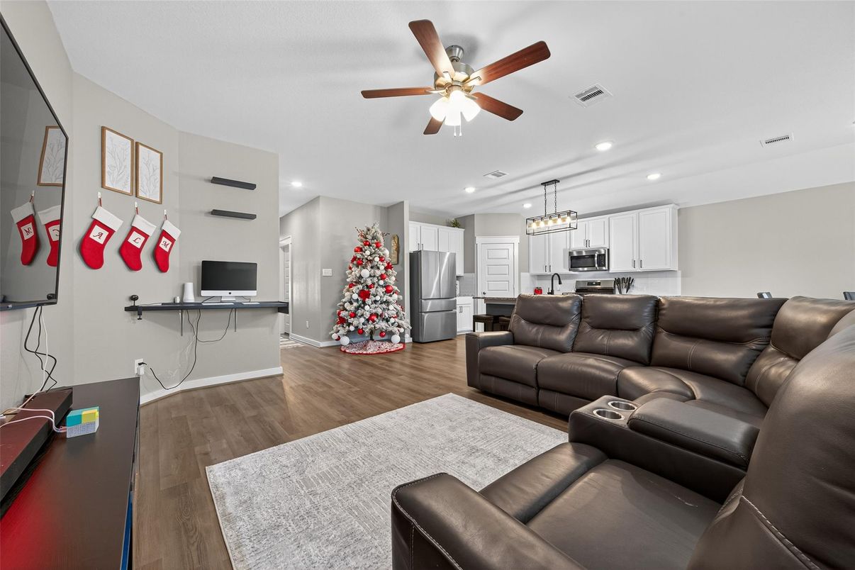 Chandelier, Home Theatre Room, Interior, Kitchen, Living room, Pendant Lights, Recessed Lighting, Stainless Steel Appliances, Wood Texture Flooring