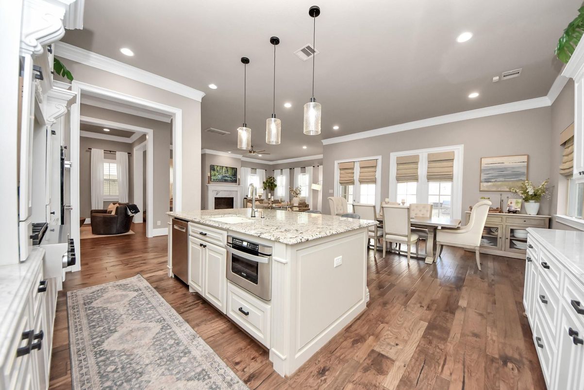 Dining room, Fireplace, Interior, Kitchen, Living room, Pendant Lights, Recessed Lighting, Stainless Steel Appliances, Wood Texture Flooring