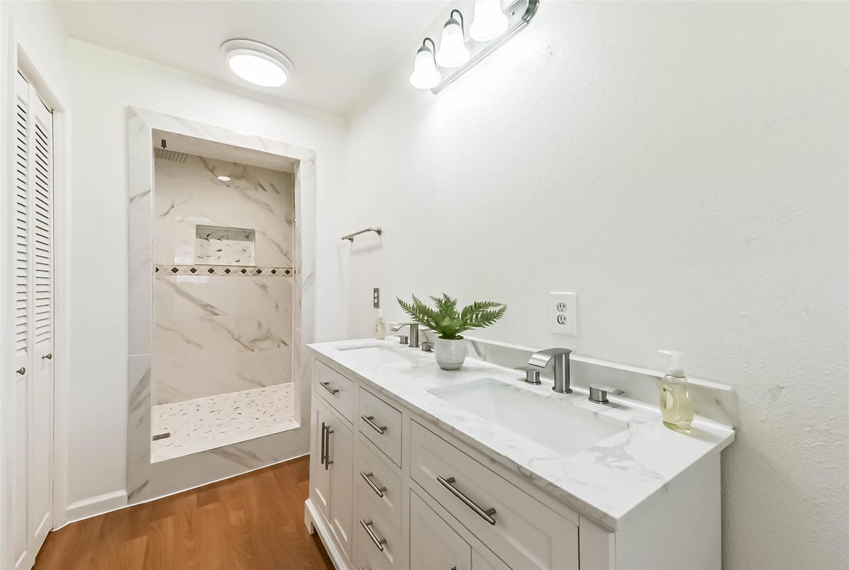 Bathroom, Dual Sink Vanities, Interior, Marble Walls, Wood Texture Flooring
