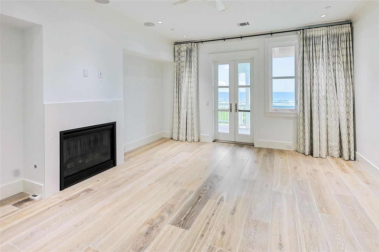 Empty room, Fireplace, Interior, Recessed Lighting, Water, Wood Texture Flooring