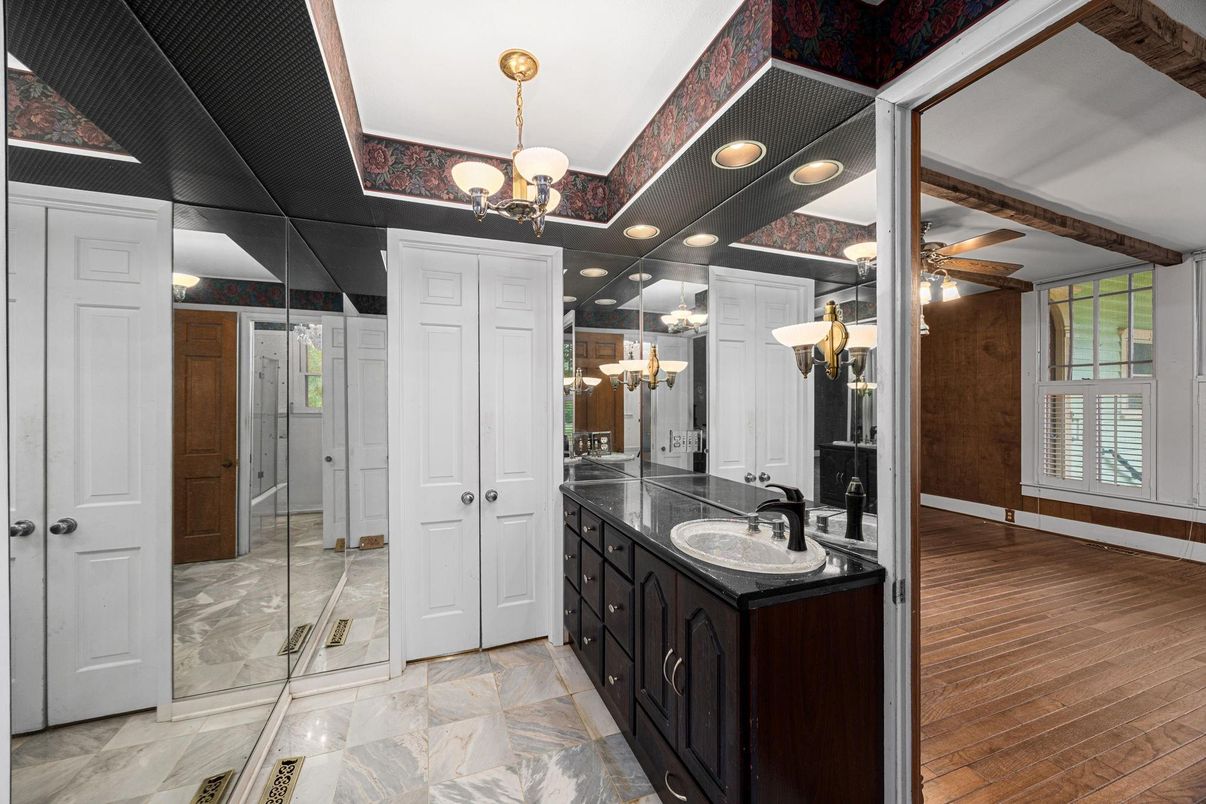 Bathroom, Chandelier, Dual Sink Vanities, Glass Shower, Interior, Wood Texture Flooring