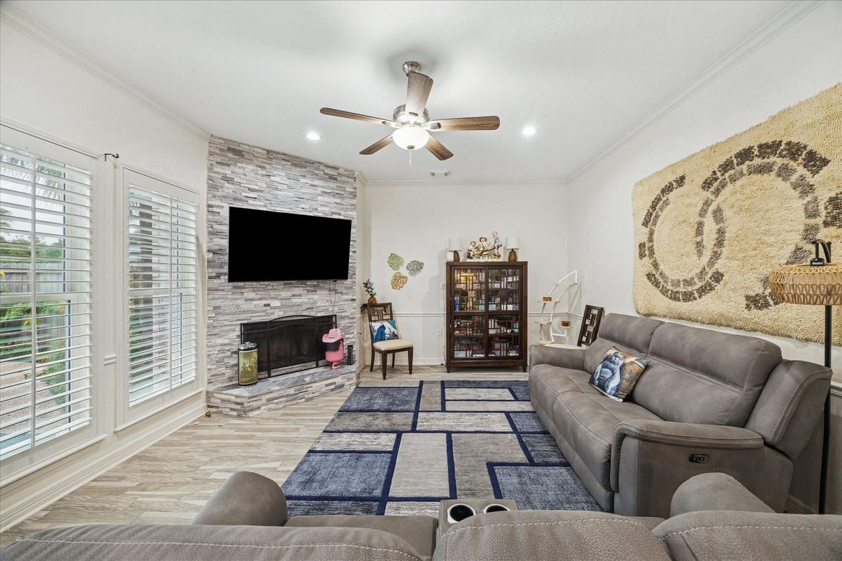 Fireplace, Interior, Living room, Recessed Lighting, Stone Walls, Wood Texture Flooring