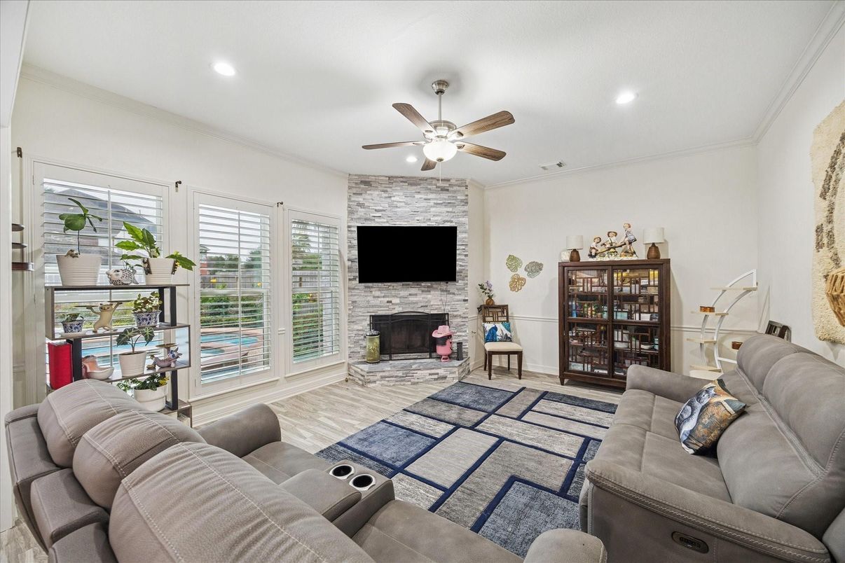 Fireplace, Interior, Living room, Recessed Lighting, Stone Walls, Wood Texture Flooring