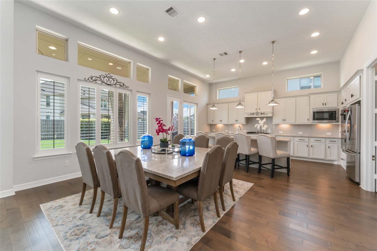 Dining room, Interior, Kitchen, Pendant Lights, Recessed Lighting, Stainless Steel Appliances, Wood Texture Flooring