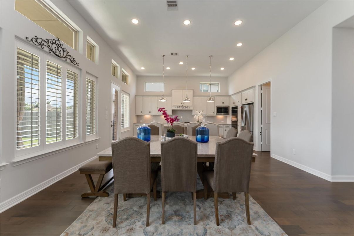 Dining room, Interior, Kitchen, Pendant Lights, Recessed Lighting, Stainless Steel Appliances, Wood Texture Flooring