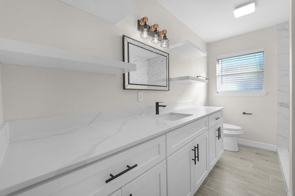 Bathroom, Dual Sink Vanities, Interior, Marble Walls, Wood Texture Flooring