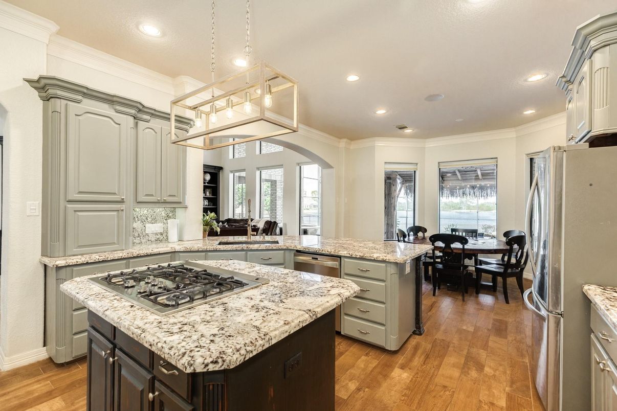 Dining room, Interior, Kitchen, Pendant Lights, Recessed Lighting, Stainless Steel Appliances, Wood Texture Flooring
