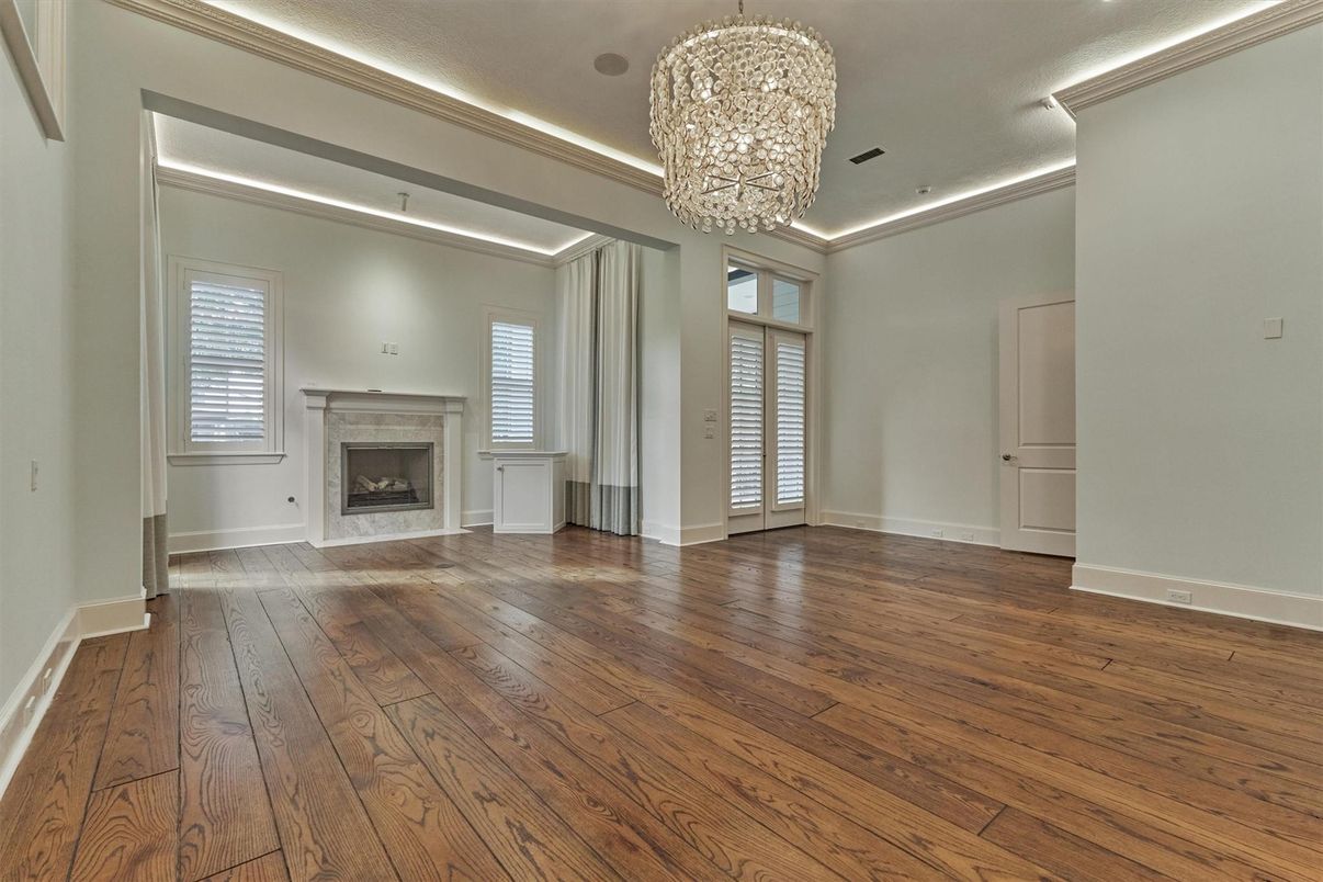 Chandelier, Empty room, Fireplace, Interior, Recessed Lighting, Wood Texture Flooring