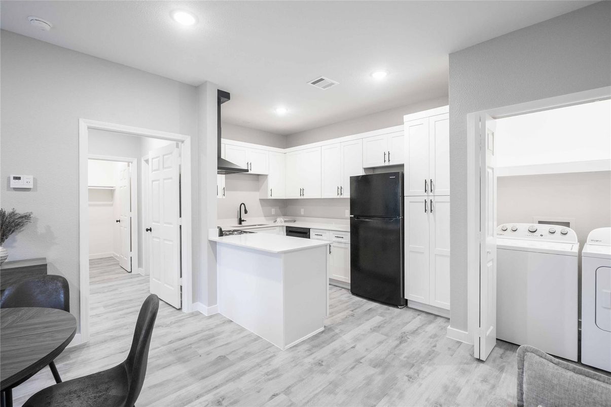 Interior, Kitchen, Recessed Lighting, Washer, Wood Texture Flooring