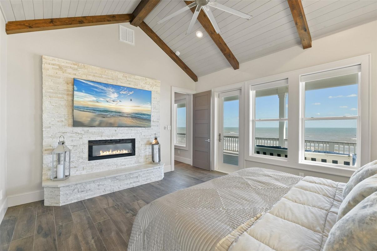 Bedroom, Fireplace, Interior, Recessed Lighting, Water, Wooden Beams, Wood Texture Flooring