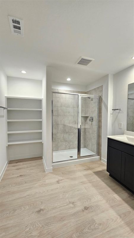 Bathroom, Glass Shower, Interior, Recessed Lighting, Walk-in Closets, Wood Texture Flooring