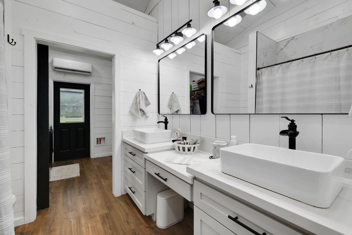 Bathroom, Dual Sink Vanities, Interior, Marble Walls, Wood Texture Flooring