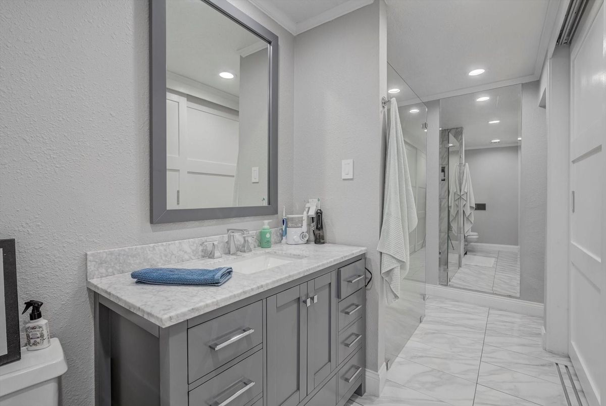 Bathroom, Dual Sink Vanities, Glass Shower, Interior, Marble, Recessed Lighting
