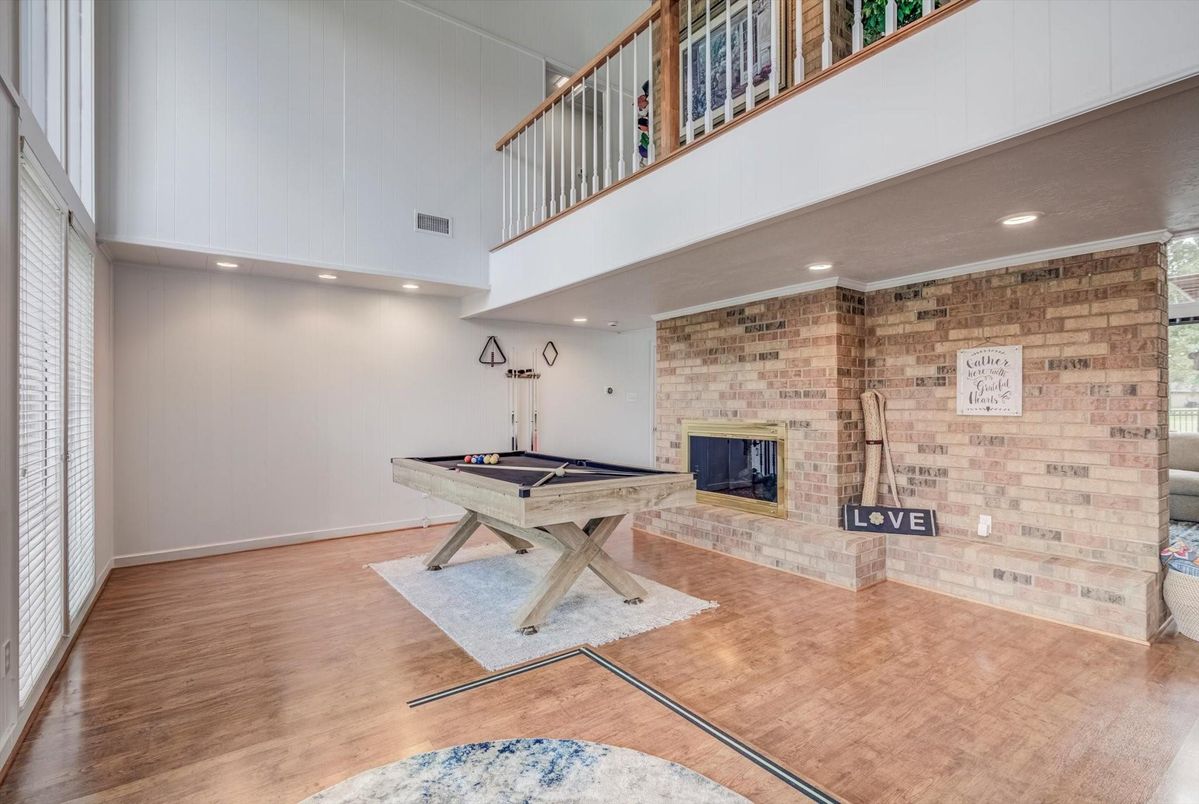 Billiard Table, Fireplace, Game Room, Interior, Recessed Lighting, Stone Walls, Wood Texture Flooring