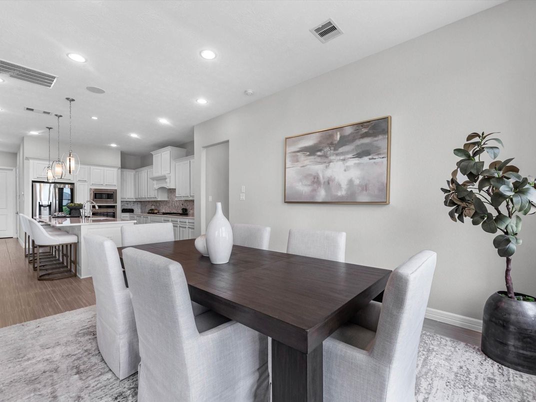 Dining room, Interior, Kitchen, Pendant Lights, Recessed Lighting, Stainless Steel Appliances, Wood Texture Flooring