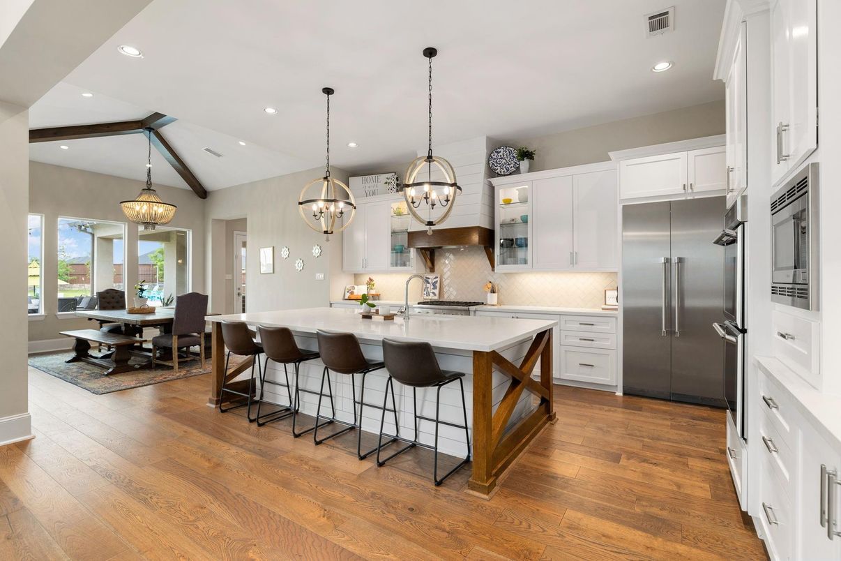 Chandelier, Dining room, Interior, Kitchen, Pendant Lights, Recessed Lighting, Stainless Steel Appliances, Wood Texture Flooring