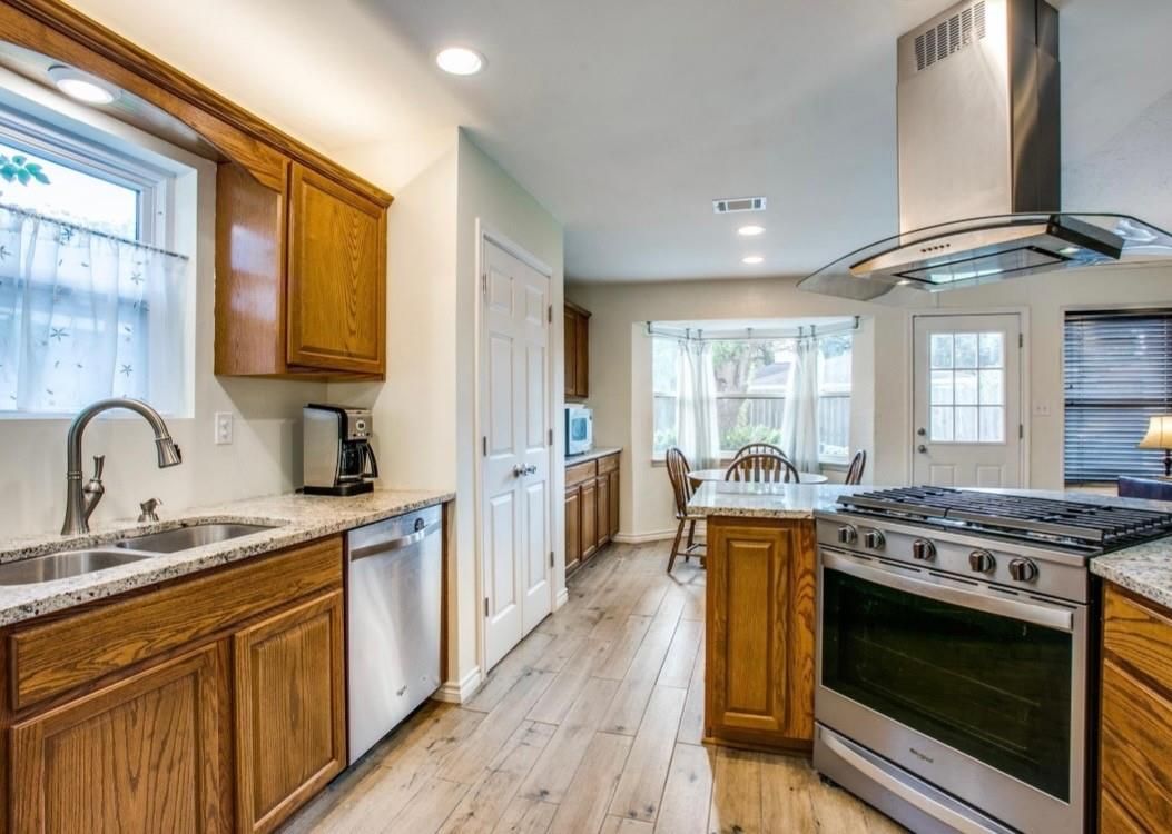 Dining room, Interior, Kitchen, Recessed Lighting, Stainless Steel Appliances, Wood Texture Flooring