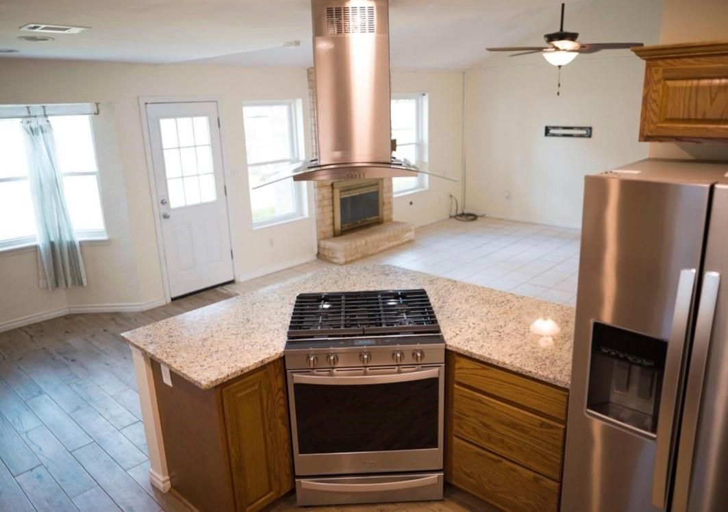 Fireplace, Interior, Kitchen, Stainless Steel Appliances, Wood Texture Flooring