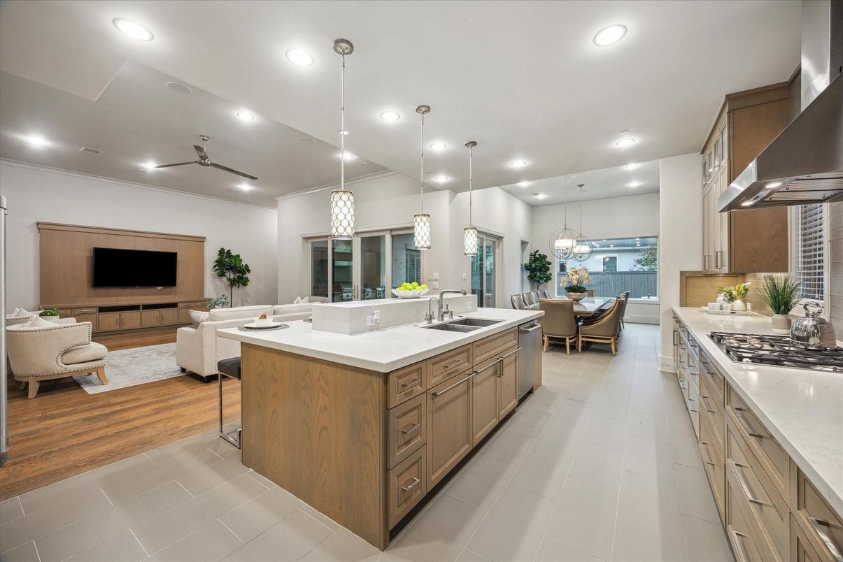 Chandelier, Dining room, Interior, Kitchen, Living room, Pendant Lights, Recessed Lighting, Stainless Steel Appliances, Wood Texture Flooring