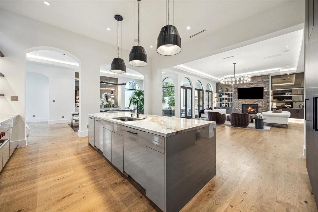 Fireplace, Interior, Kitchen, Living room, Pendant Lights, Recessed Lighting, Stainless Steel Appliances, Wood Texture Flooring