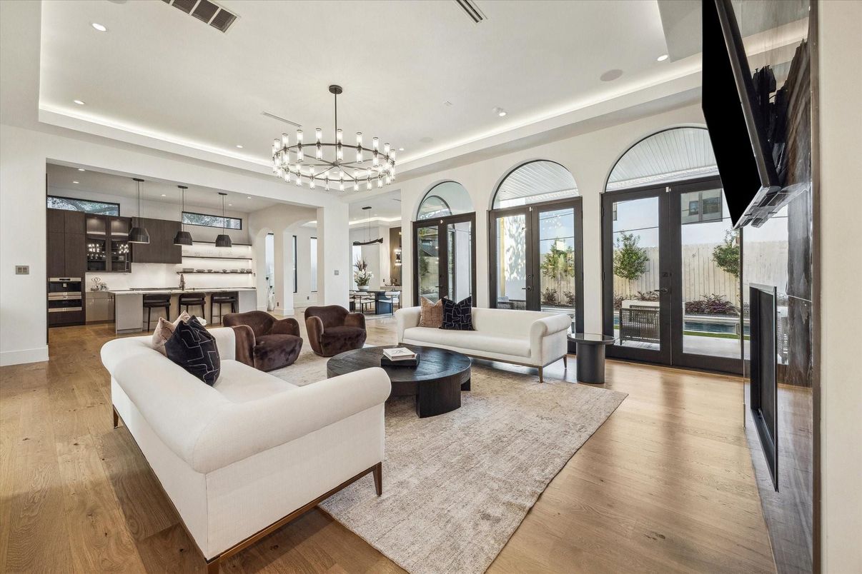 Chandelier, Interior, Kitchen, Living room, Pendant Lights, Recessed Lighting, Stainless Steel Appliances, Wood Texture Flooring