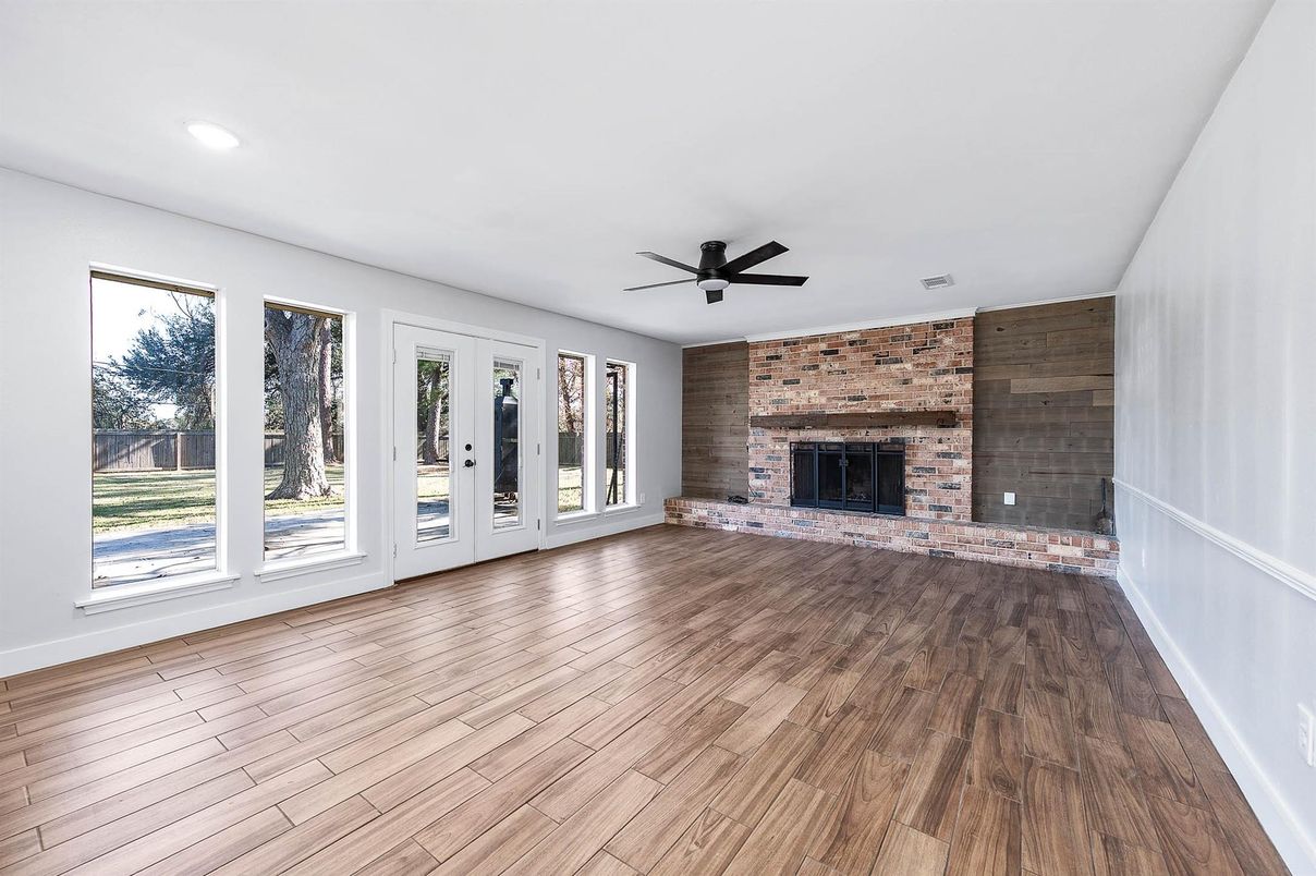 Empty room, Fireplace, Interior, Recessed Lighting, Stone Walls, Wood Texture Flooring, Wooden Walls