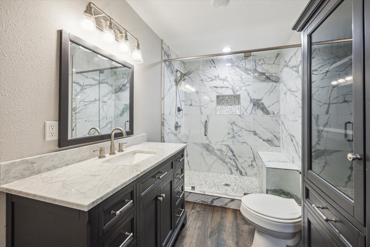 Bathroom, Glass Shower, Interior, Marble Walls, Recessed Lighting, Wood Texture Flooring