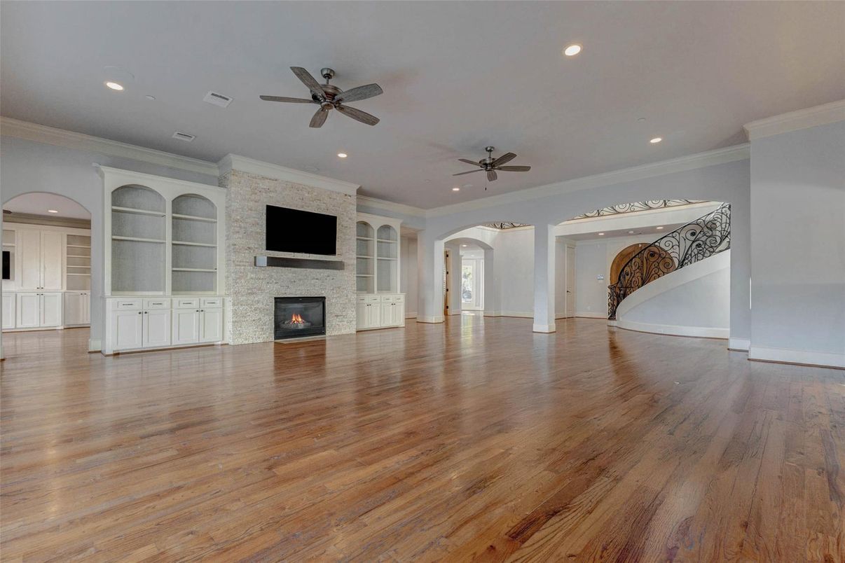 Empty room, Fireplace, Interior, Recessed Lighting, Stone Walls, Wood Texture Flooring