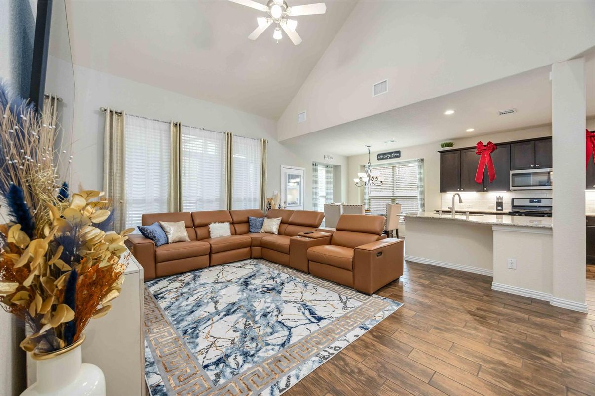 Chandelier, Dining room, Interior, Kitchen, Living room, Pendant Lights, Recessed Lighting, Stainless Steel Appliances, Wood Texture Flooring