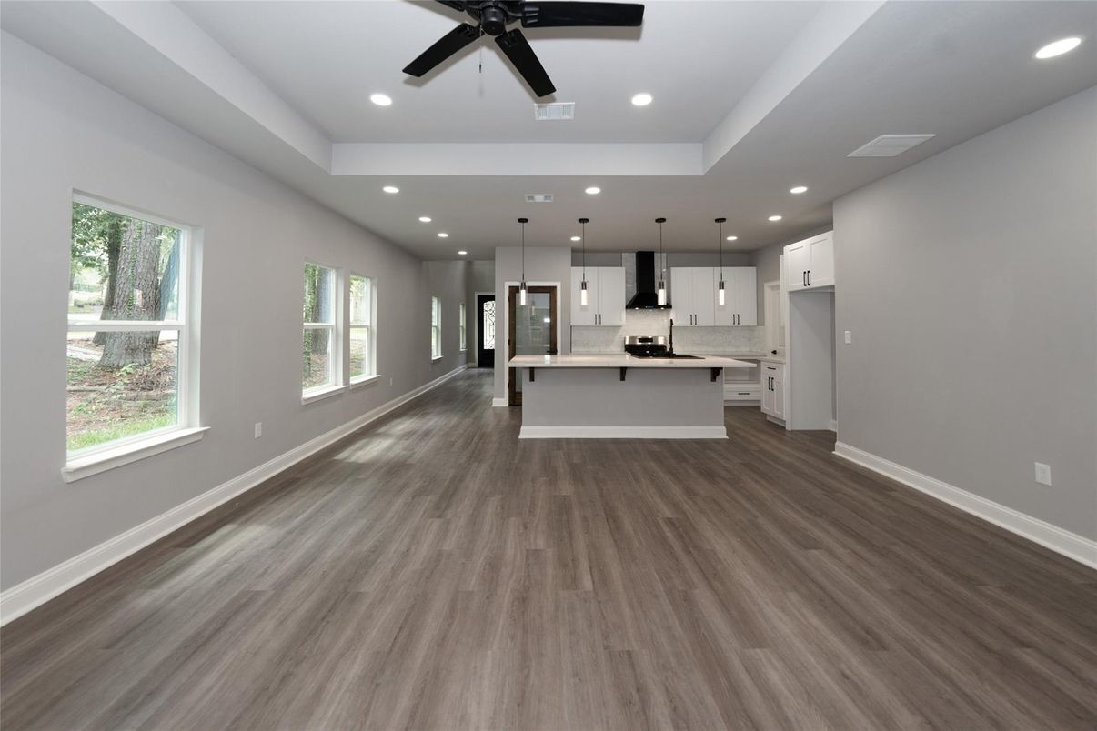 Empty room, Interior, Kitchen, Pendant Lights, Recessed Lighting, Stainless Steel Appliances, Wood Texture Flooring