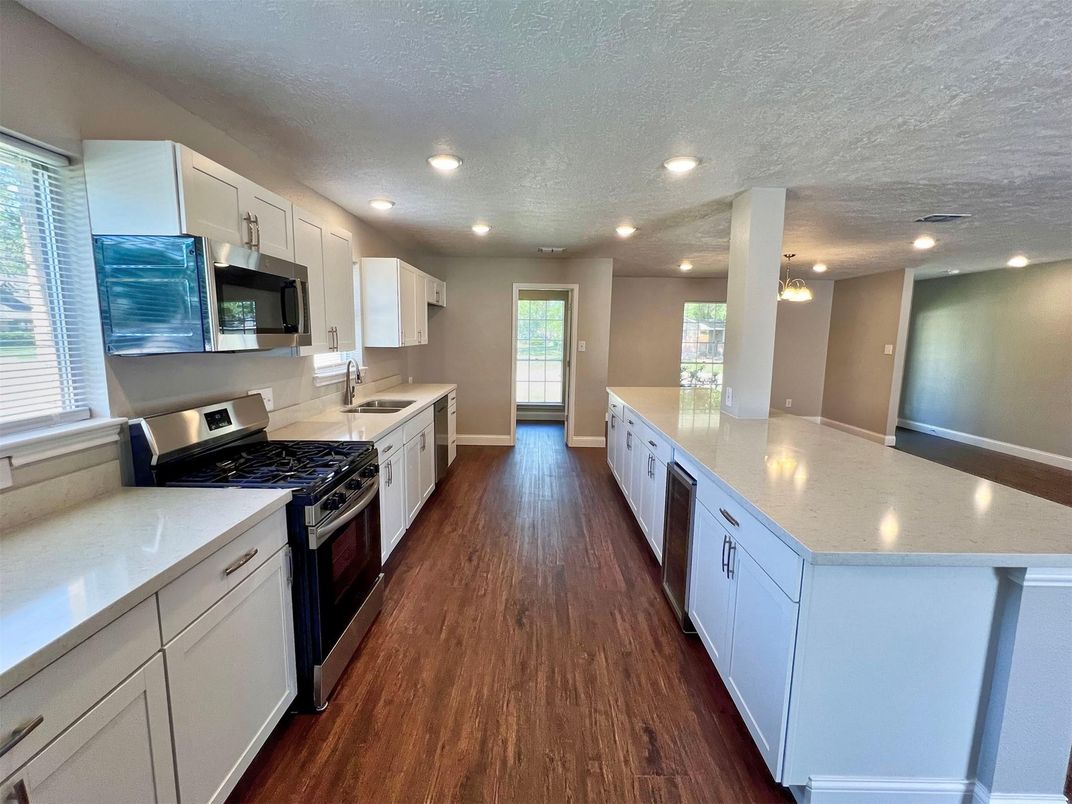 Interior, Kitchen, Pendant Lights, Recessed Lighting, Stainless Steel Appliances, Wood Texture Flooring